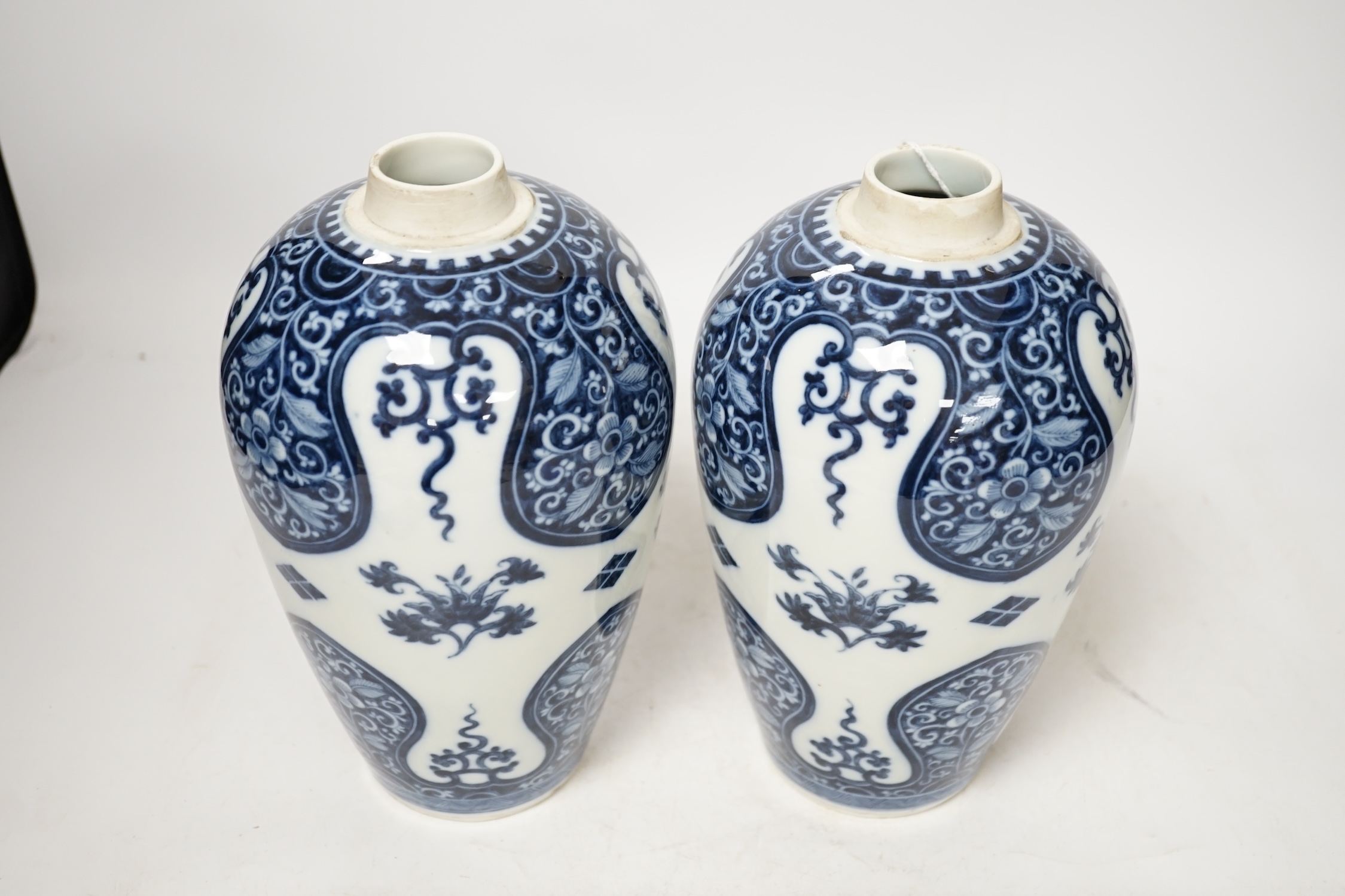 A pair of Samson of Paris blue and white vases, in Kangxi style 23cm high. Condition - good